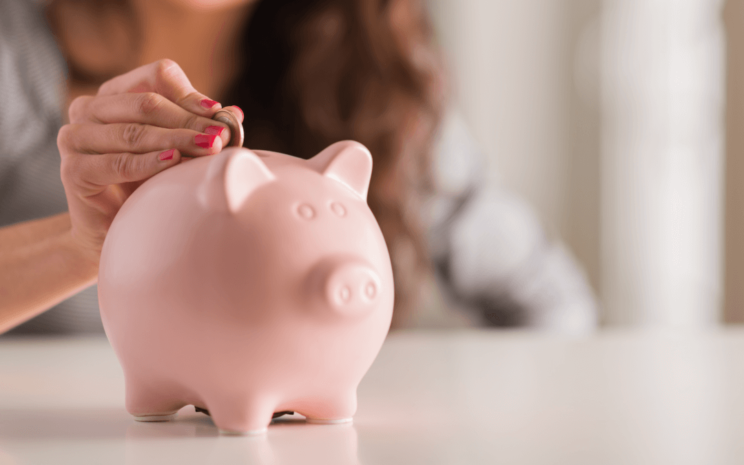 putting money into a piggy bank